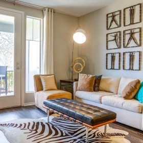 a living room with a couch and glass doors