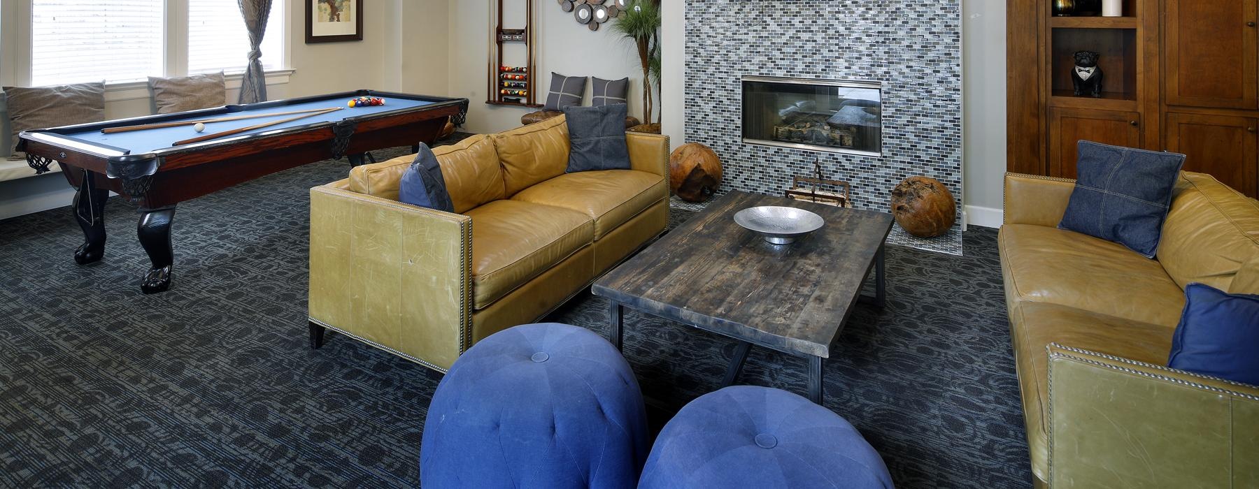 a lounge room with a fireplace and a tv